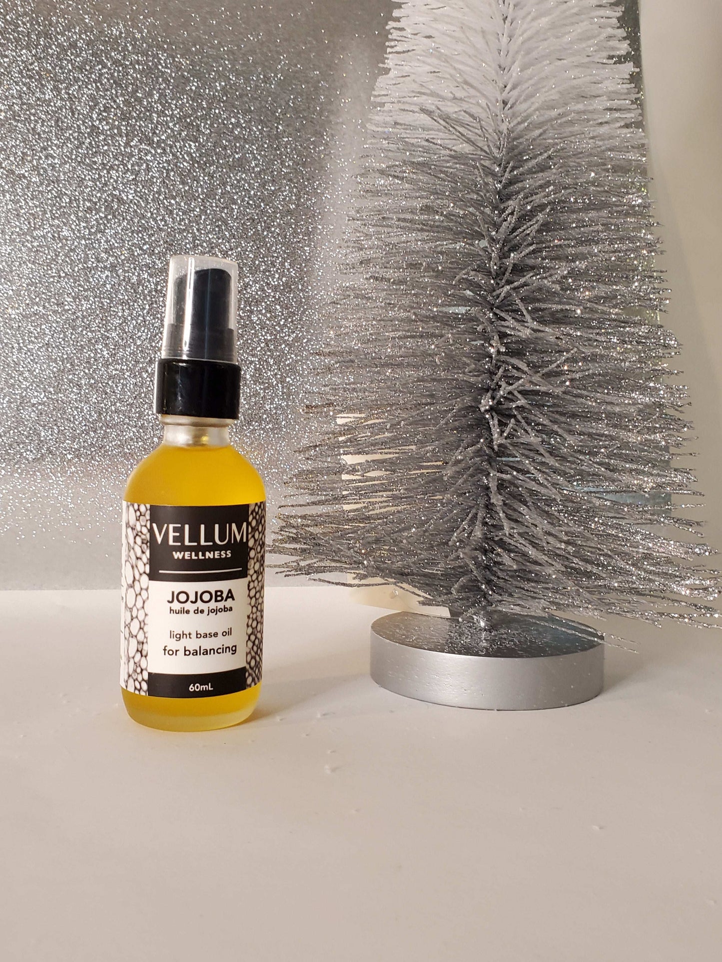 Pure Jojoba Carrier Oil by Vellum Wellness, balancing skin-smoothing hydration mimics sebum to regulate oil production, rich in vitamin E for acne psoriasis and hair health, non-comedogenic 60mL vegan bottle.