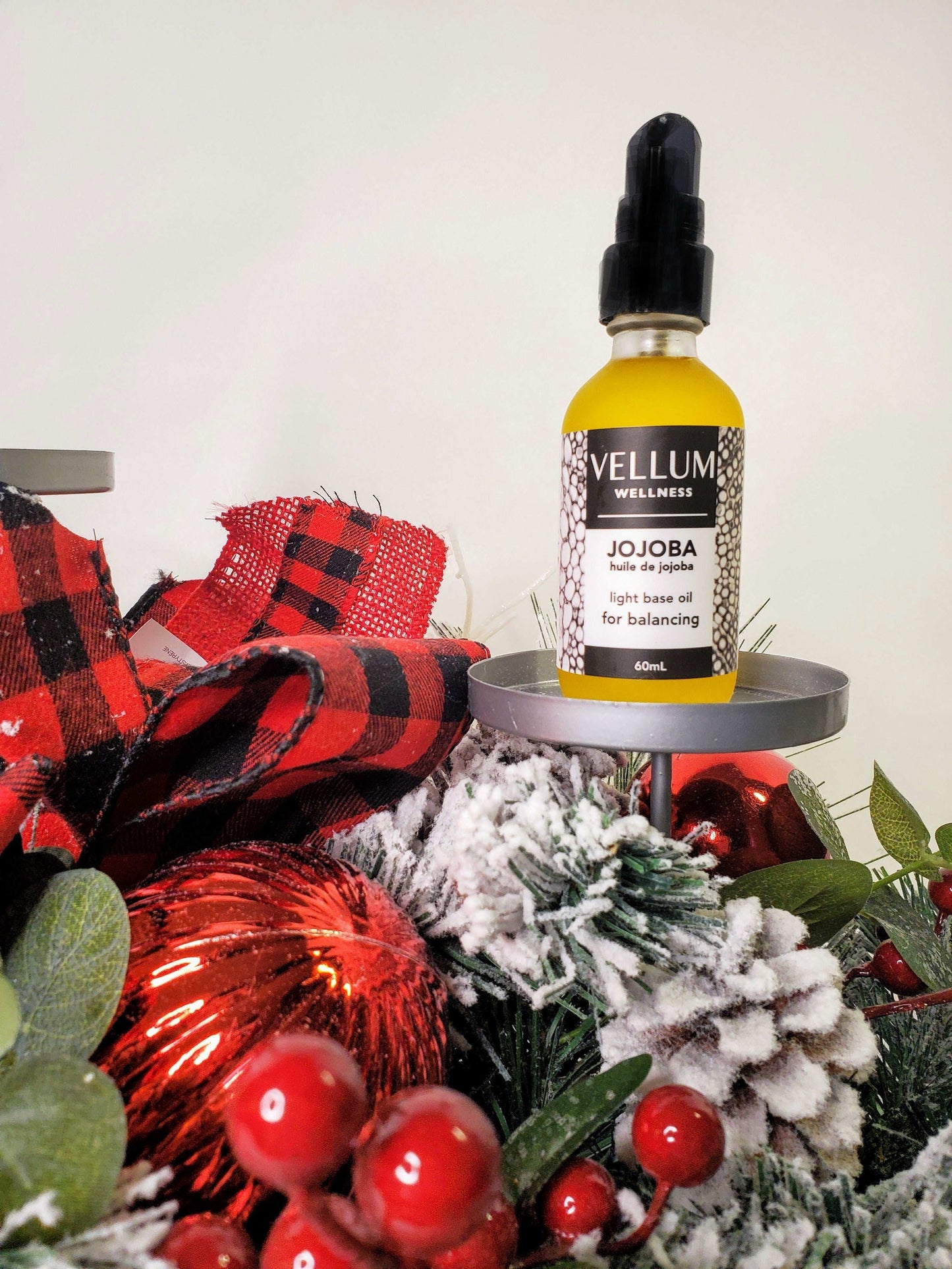 Pure Jojoba Carrier Oil by Vellum Wellness, balancing skin-smoothing hydration mimics sebum to regulate oil production, rich in vitamin E for acne psoriasis and hair health, non-comedogenic 60mL vegan bottle.